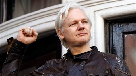what is julian assange in prison for